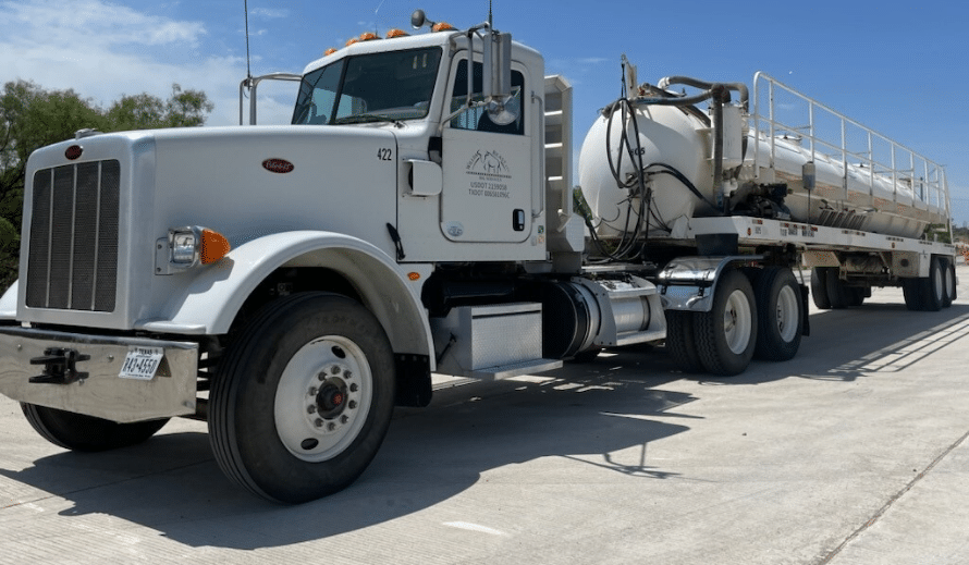 Long White Sewer Truck with Willda Beast Logo on the Side